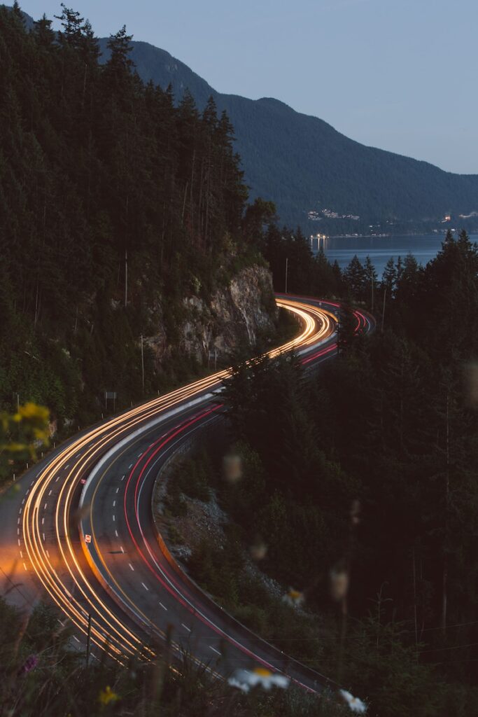 a long exposure shot of a highway at night